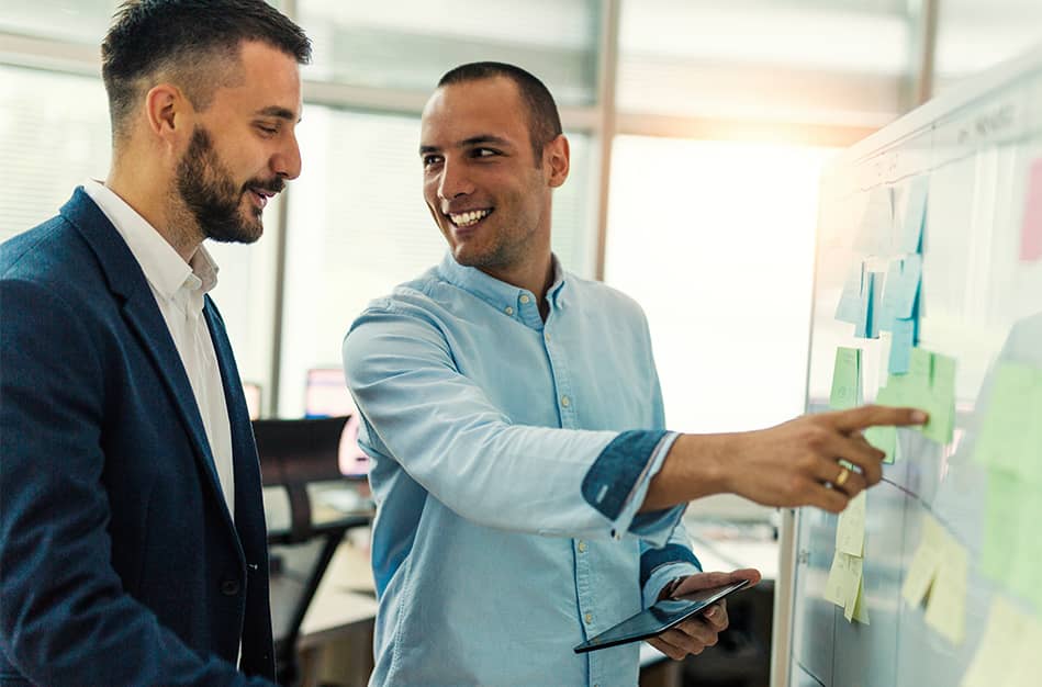 IT expert discussing strategy with business professional